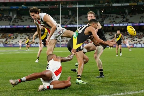 Bradley Hill of the Saints tackles Marlion Pickett of the Tigers during the round 15 AFL match between the Richmond Tigers and the St Kilda Saints at...