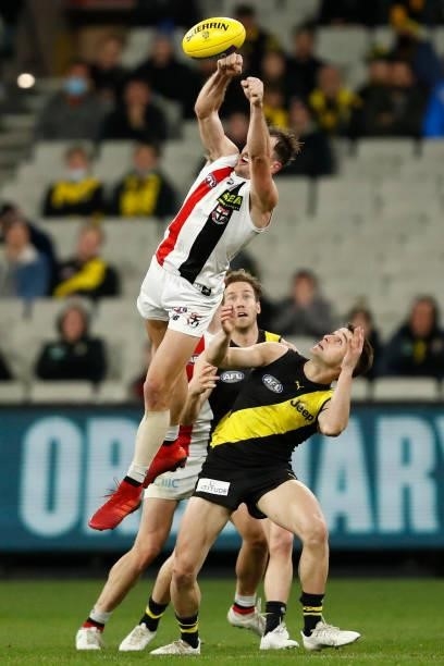 Daniel McKenzie of the Saints spoils the ball during the round 15 AFL match between the Richmond Tigers and the St Kilda Saints at Melbourne Cricket...