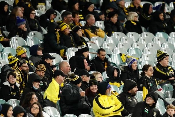 Disappointed Richmond fans look on during the round 15 AFL match between the Richmond Tigers and the St Kilda Saints at Melbourne Cricket Ground on...