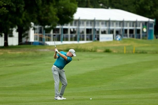 Richard McEvoy of England plays his second shot on the 18th hole during the second round of The BMW International Open at Golfclub Munchen Eichenried...