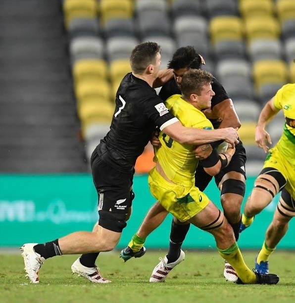 Nick Malouf of Australia is tackled during the Oceania Sevens Challenge match between New Zealand and Australia at Queensland Country Bank Stadium on...