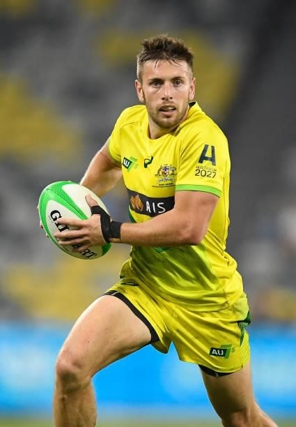 Josh Turner of Australia runs the ball during the Oceania Sevens Challenge match between New Zealand and Australia at Queensland Country Bank Stadium...