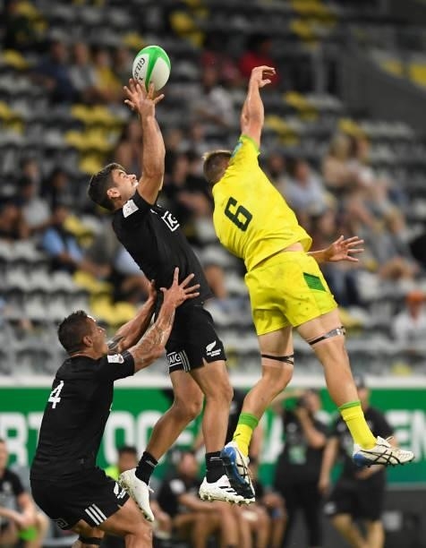 Andrew Knewstubb of New Zealand and Joe Pincus of Australia contest the ball during the Oceania Sevens Challenge match between New Zealand and...