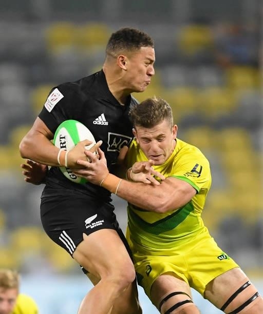 William Warbrick of New Zealand is tackled by Nick Malouf of Australia during the Oceania Sevens Challenge match between New Zealand and Australia at...