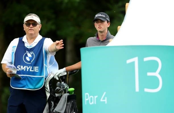 Elvis Symlie of Australia and his caddie Michael Waite on the 13th tee during the second round of The BMW International Open at Golfclub Munchen...