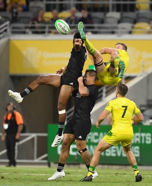 Akuila Rokolisoa of New Zealand and Nick Malouf of Australia contest the ball during the Oceania Sevens Challenge match between New Zealand and...