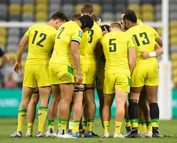 The Australian team gathers in a huddle during the Oceania Sevens Challenge match between New Zealand and Australia at Queensland Country Bank...