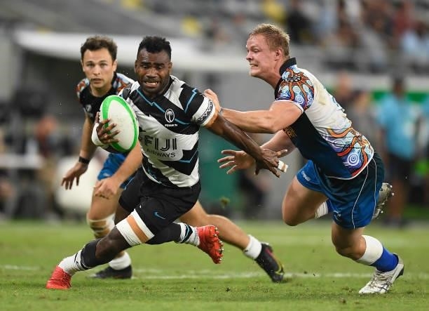 Jerry Tuwai of Fiji gets away from a tackle during the Oceania Sevens Challenge match between Fiji and Oceania at Queensland Country Bank Stadium on...
