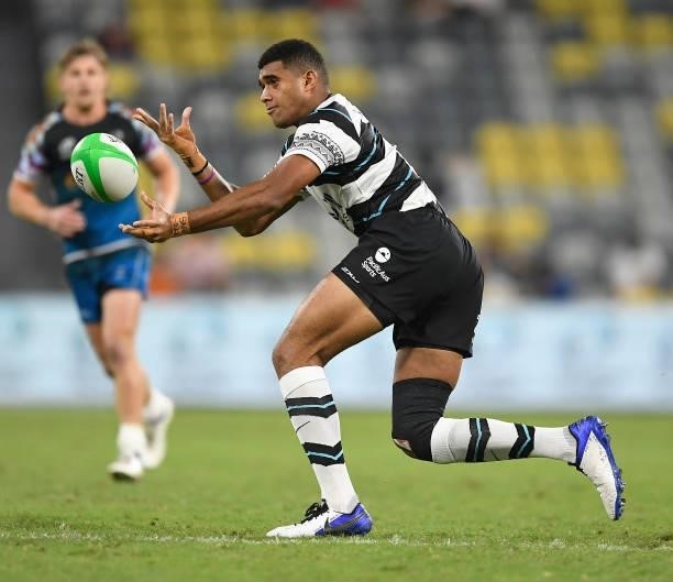 Meli Derenalagi of Fiji passes the ball during the Oceania Sevens Challenge match between Fiji and Oceania at Queensland Country Bank Stadium on June...