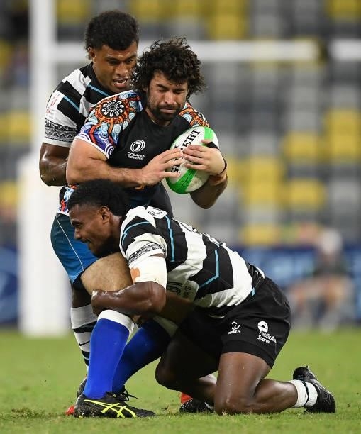 Bennett Leslie of Oceania is tackled during the Oceania Sevens Challenge match between Fiji and Oceania at Queensland Country Bank Stadium on June...