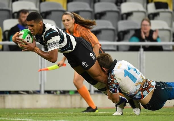 Meli Derenalagi of Fiji scores a try during the Oceania Sevens Challenge match between Fiji and Oceania at Queensland Country Bank Stadium on June...