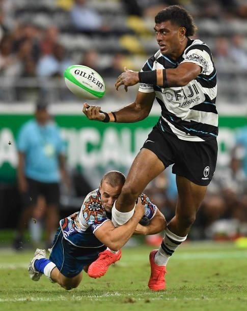Taniela Sadrugu of Fiji passes the ball during the Oceania Sevens Challenge match between Fiji and Oceania at Queensland Country Bank Stadium on June...