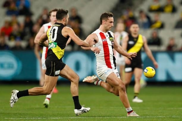 Luke Dunstan of the Saints kicks the ball during the round 15 AFL match between the Richmond Tigers and the St Kilda Saints at Melbourne Cricket...