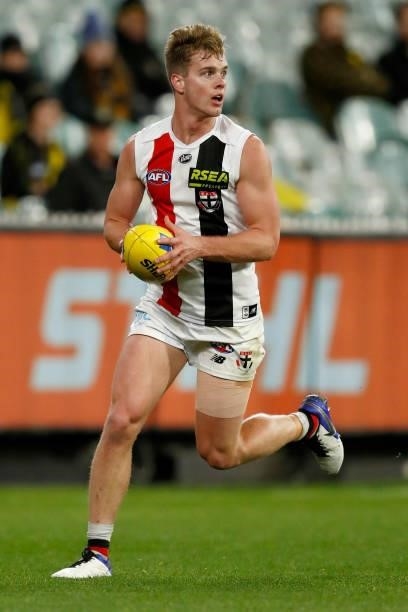 Thomas Highmore of the Saints runs with the ball during the round 15 AFL match between the Richmond Tigers and the St Kilda Saints at Melbourne...