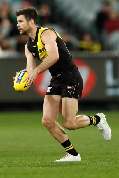 Trent Cotchin of the Tigers runs with the ball during the round 15 AFL match between the Richmond Tigers and the St Kilda Saints at Melbourne Cricket...