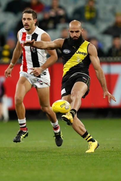 Bachar Houli of the Tigers kicks the ball during the round 15 AFL match between the Richmond Tigers and the St Kilda Saints at Melbourne Cricket...