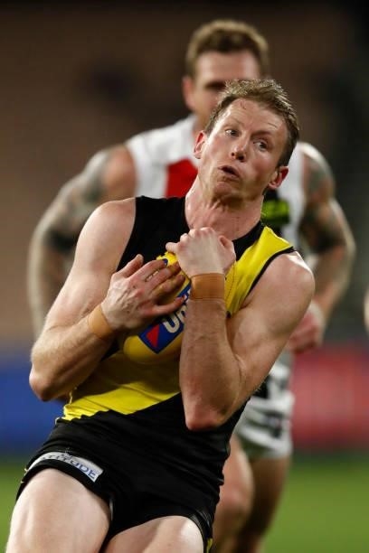 Dylan Grimes of the Tigers marks the ball during the round 15 AFL match between the Richmond Tigers and the St Kilda Saints at Melbourne Cricket...