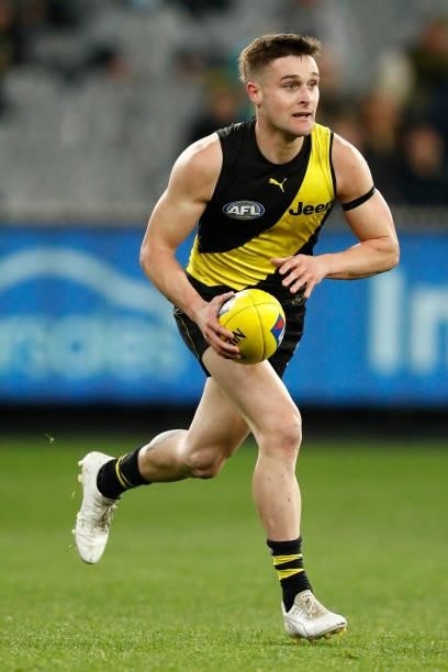Jayden Short of the Tigers runs with the ball during the round 15 AFL match between the Richmond Tigers and the St Kilda Saints at Melbourne Cricket...