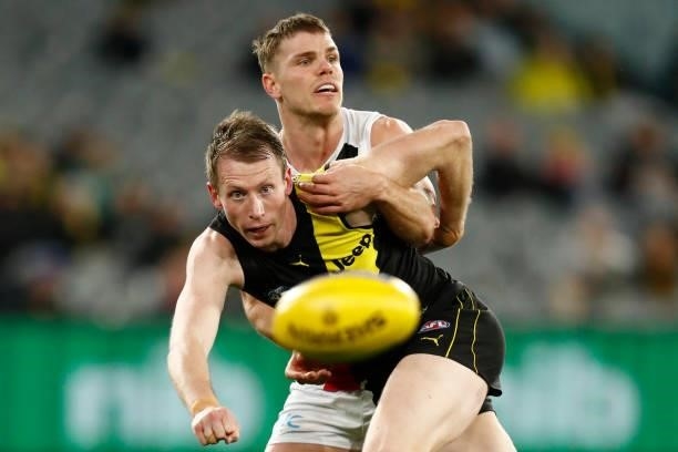 Mason Wood of the Saints and Dylan Grimes of the Tigers compete during the round 15 AFL match between the Richmond Tigers and the St Kilda Saints at...