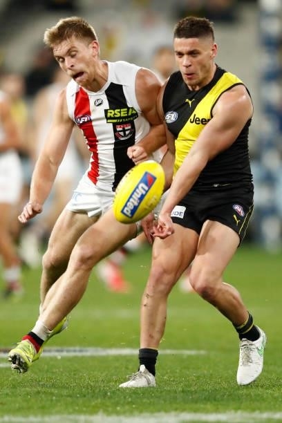 Sebastian Ross of the Saints and Dion Prestia of the Tigers collide during the round 15 AFL match between the Richmond Tigers and the St Kilda Saints...