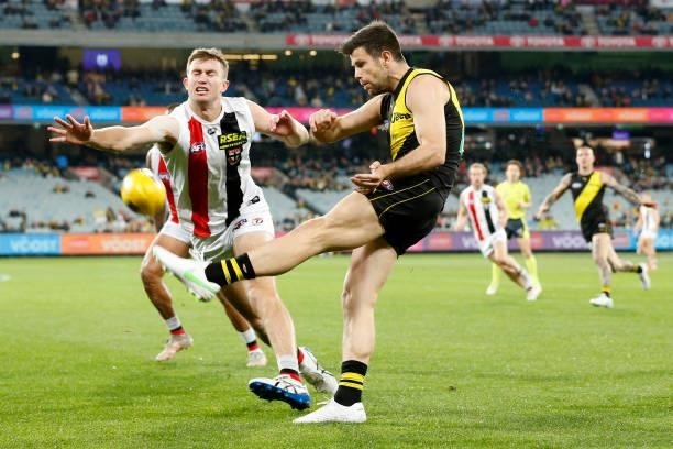 Trent Cotchin of the Tigers kicks the ball during the round 15 AFL match between the Richmond Tigers and the St Kilda Saints at Melbourne Cricket...
