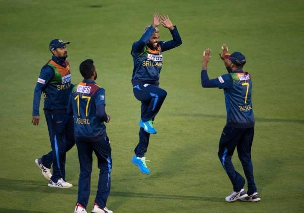 Wanindu Hasaranga of Sri Lanka celebrates with team mates after taking the wicket of Jason Roy of England during the 2nd T20I between England and Sri...