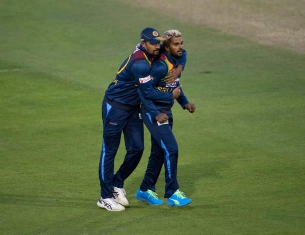 Wanindu Hasaranga of Sri Lanka celebrates with team mate Danushka Gunathilaka after taking the wicket of Jason Roy of England during the 2nd T20I...