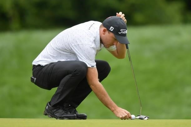 Russell Henley of the United States lines up a putt on the 14th green during the second round of the Travelers Championship at TPC River Highlands on...