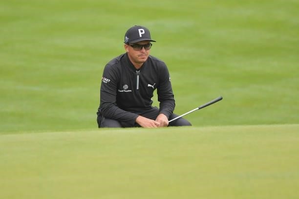 Rickie Fowler of the United States looks over a putt on the 15th green during the second round of the Travelers Championship at TPC River Highlands...