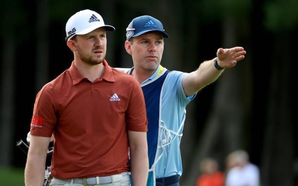 Connor Syme of Scotland and his caddie on the 18th hole during the second round of The BMW International Open at Golfclub Munchen Eichenried on June...