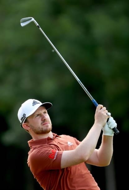 Connor Syme of Scotland plays his second shot on the 18th hole during the second round of The BMW International Open at Golfclub Munchen Eichenried...