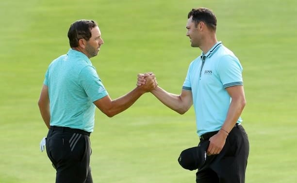 Sergio Garcia of Spain and Martin Kaymer of Germany shake hands after the second round of The BMW International Open at Golfclub Munchen Eichenried...