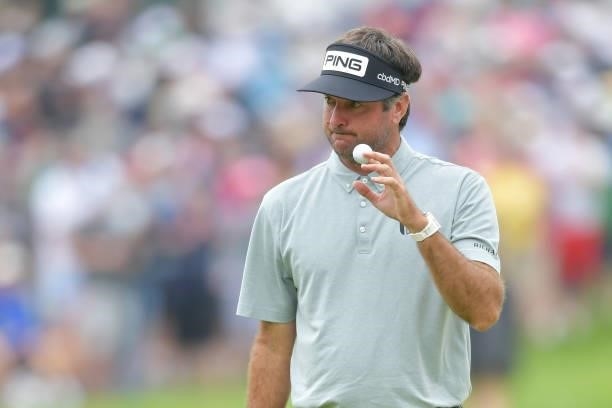 Bubba Watson of the United States reacts to his putt on the eighth green during the second round of the Travelers Championship at TPC River Highlands...