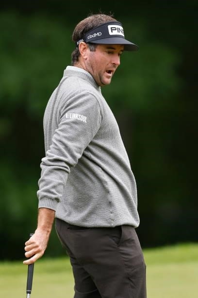 Bubba Watson of the United States reacts to his missed putt on the tenth green during the second round of the Travelers Championship at TPC River...