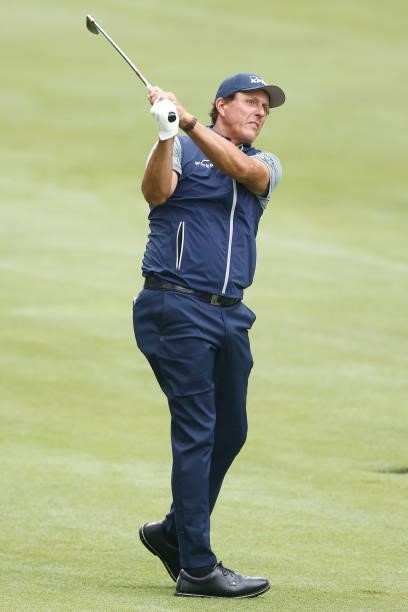 Phil Mickelson of the United States plays a shot on the tenth hole during the second round of the Travelers Championship at TPC River Highlands on...