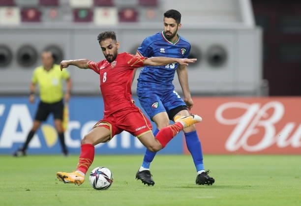 Ali Madan of Bahrain is put under pressure by Fahad Alreshidi of Kuwait during the FIFA Arab Cup 2021 Qualifying match between Bahrain and Kuwait at...