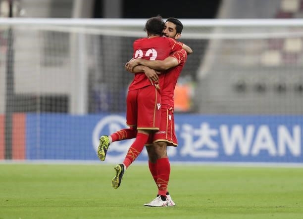 Rashed Alhooti and Abdulla Alhazaa of Bahrain celebrate after winning the FIFA Arab Cup 2021 Qualifying match between Bahrain and Kuwait at Khalifa...