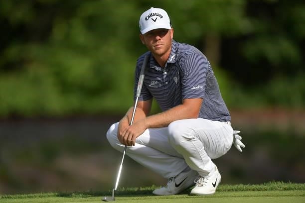 Talor Gooch of the United States looks on from the 14th green during the second round of the Travelers Championship at TPC River Highlands on June...