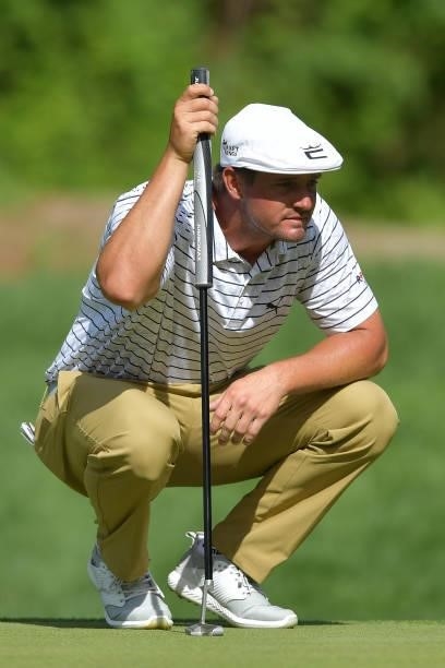 Bryson DeChambeau of the United States looks over a putt on the 14th green during the second round of the Travelers Championship at TPC River...