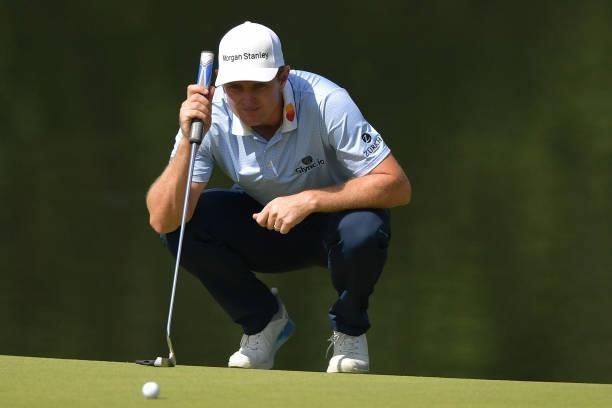 Justin Rose of England looks over a putt on the 13th green during the second round of the Travelers Championship at TPC River Highlands on June 25,...