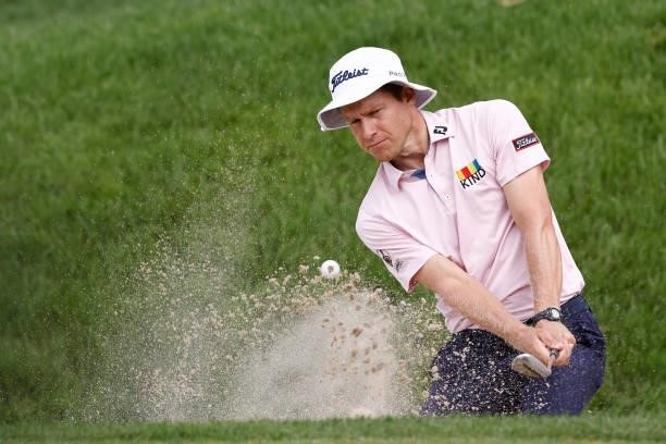 Peter Malnati of the United States plays a shot from a bunker on the sixth hole during the second round of the Travelers Championship at TPC River...