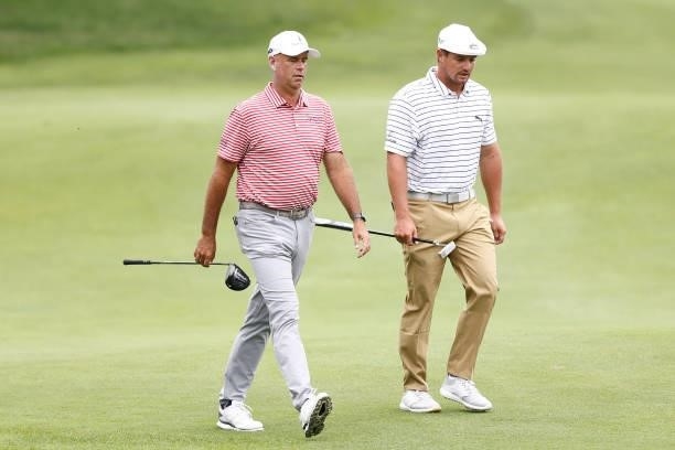 Stewart Cink of the United States and Bryson DeChambeau of the United States walk to the sixth tee during the second round of the Travelers...