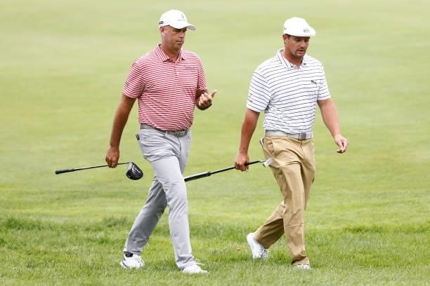 Stewart Cink of the United States and Bryson DeChambeau of the United States walk to the sixth tee during the second round of the Travelers...