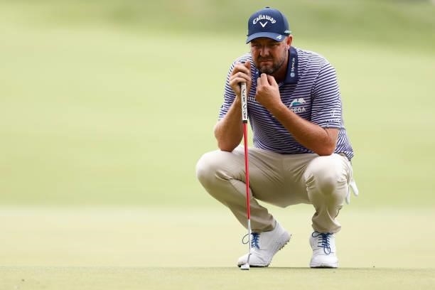 Marc Leishman of Australia looks over a putt on the seventh green during the second round of the Travelers Championship at TPC River Highlands on...