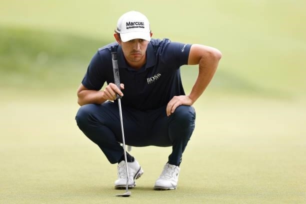 Patrick Cantlay of the United States looks over a putt on the sixth green during the second round of the Travelers Championship at TPC River...
