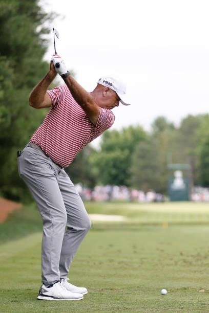 Stewart Cink of the United States plays his shot from the eighth tee during the second round of the Travelers Championship at TPC River Highlands on...