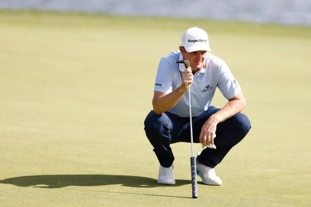 Justin Rose of England looks over a putt on the 17th green during the second round of the Travelers Championship at TPC River Highlands on June 25,...