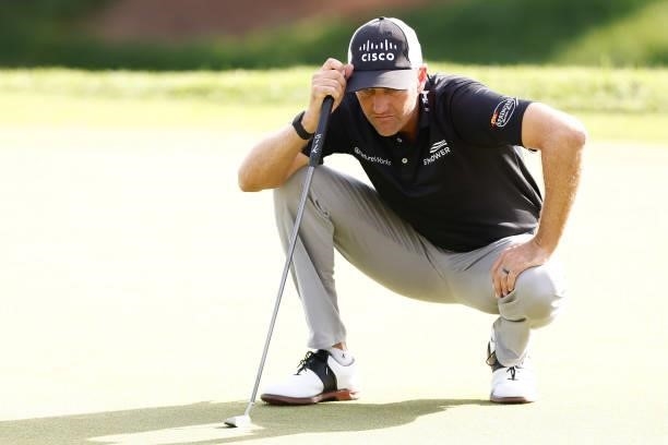 Brendon Todd of the United States looks over a putt on the eighth green during the second round of the Travelers Championship at TPC River Highlands...