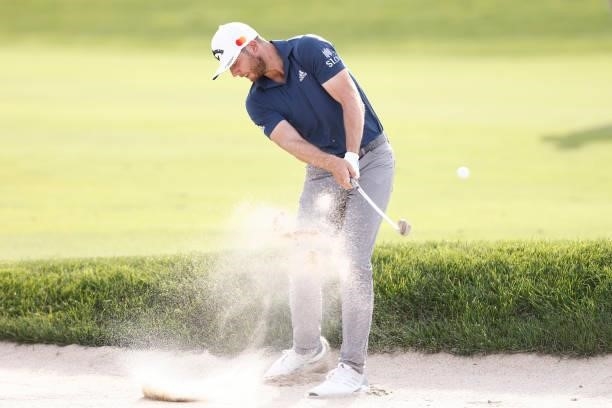 Sam Burns of the United States plays a shot from a bunker on the ninth hole during the second round of the Travelers Championship at TPC River...