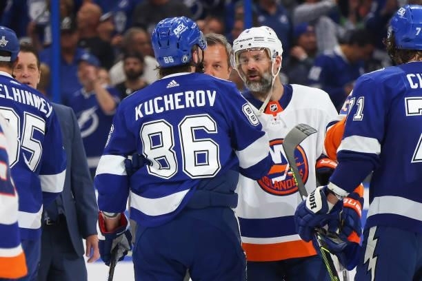 Andy Greene of the New York Islanders shakes hands with Nikita Kucherov of the Tampa Bay Lightning after the Lightning's 1-0 victory in Game Seven of...